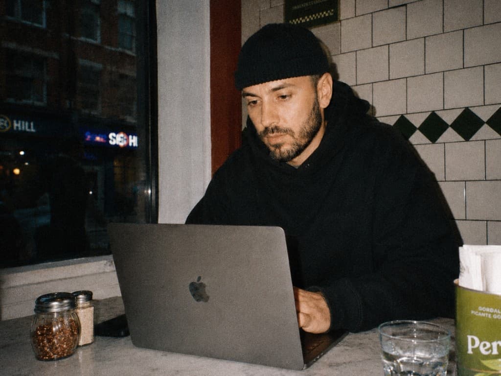 Restaurant operator managing multiple venues on a laptop